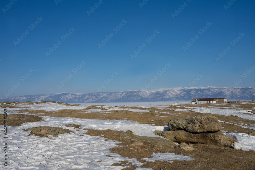 rocks with ice overlaps and icicles near the lake rocks with ice overlaps and icicles near the lake