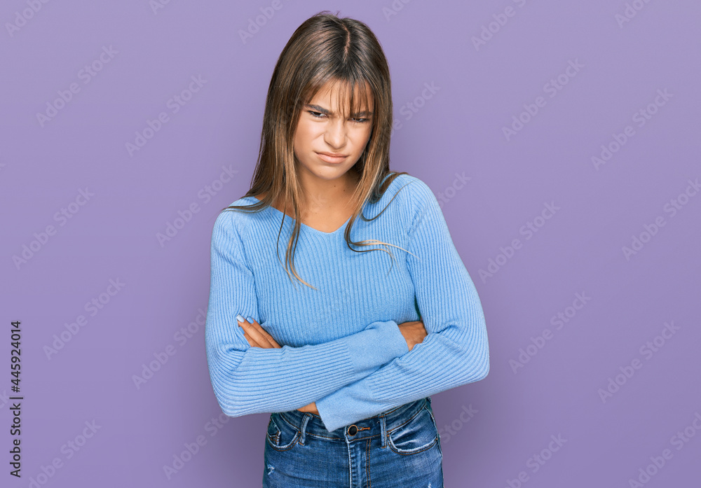 Teenager caucasian girl wearing casual clothes skeptic and nervous, disapproving expression on face with crossed arms. negative person. Teenager caucasian girl wearing casual clothes skeptic and nervous, disapproving expression on face with crossed arms. negative person.