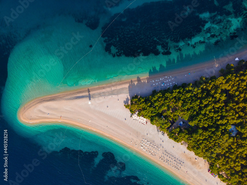 Croatia, Brac island, Bol. Panoramic aerial view of the Zlatni Rat sandy beach and sea from made with drone. Top view