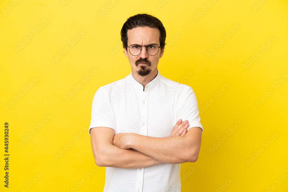 Young caucasian man isolated on yellow background feeling upset Young caucasian man isolated on yellow background feeling upset