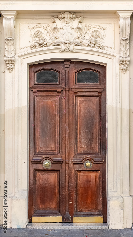 Paris, an ancient wooden door, typical building in the 10e arrondissement
Paris, an ancient wooden door, typical building in the 10e arrondissement