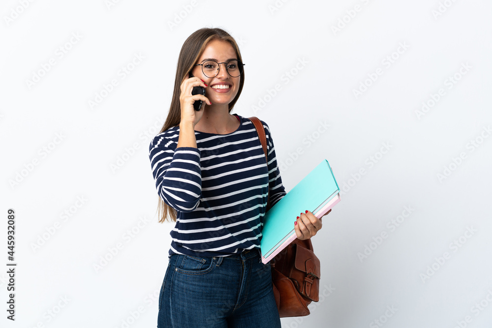 Young student woman isolated on white background holding coffee to take away and a mobile Young student woman isolated on white background holding coffee to take away and a mobile