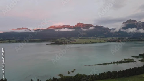 Bavarian Alps with mountains, a lake, clouds in the sunset