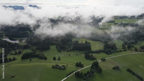 A flight in the Bavarian clouds with green forests