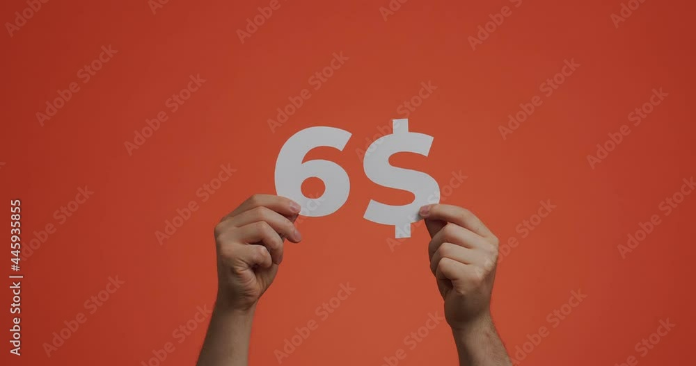 Six dollars, hands showing cost of purchase. Man show price. Sale, donating, charity, auction concept Six dollars, hands showing cost of purchase. Man show price. Sale, donating, charity, auction concept