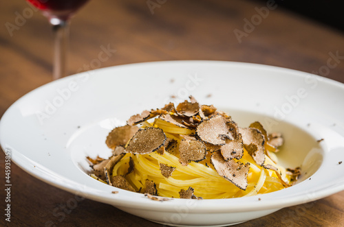 Pasta with truffles. Restaurant menu plate.	 photo