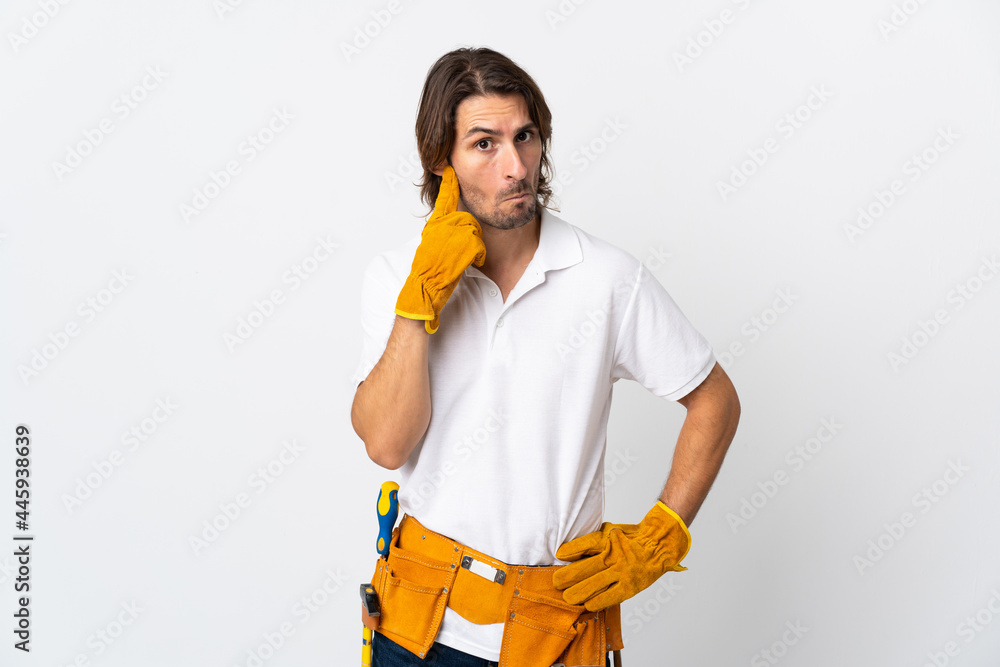 Young electrician man over isolated background thinking an idea Young electrician man over isolated background thinking an idea