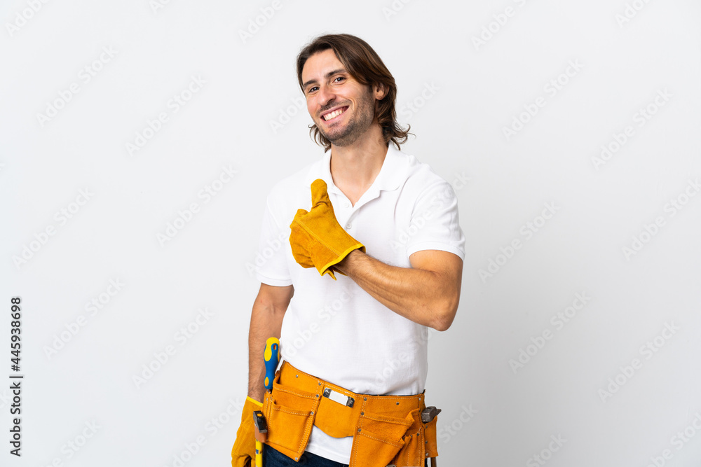 Young electrician man over isolated background giving a thumbs up gesture Young electrician man over isolated background giving a thumbs up gesture