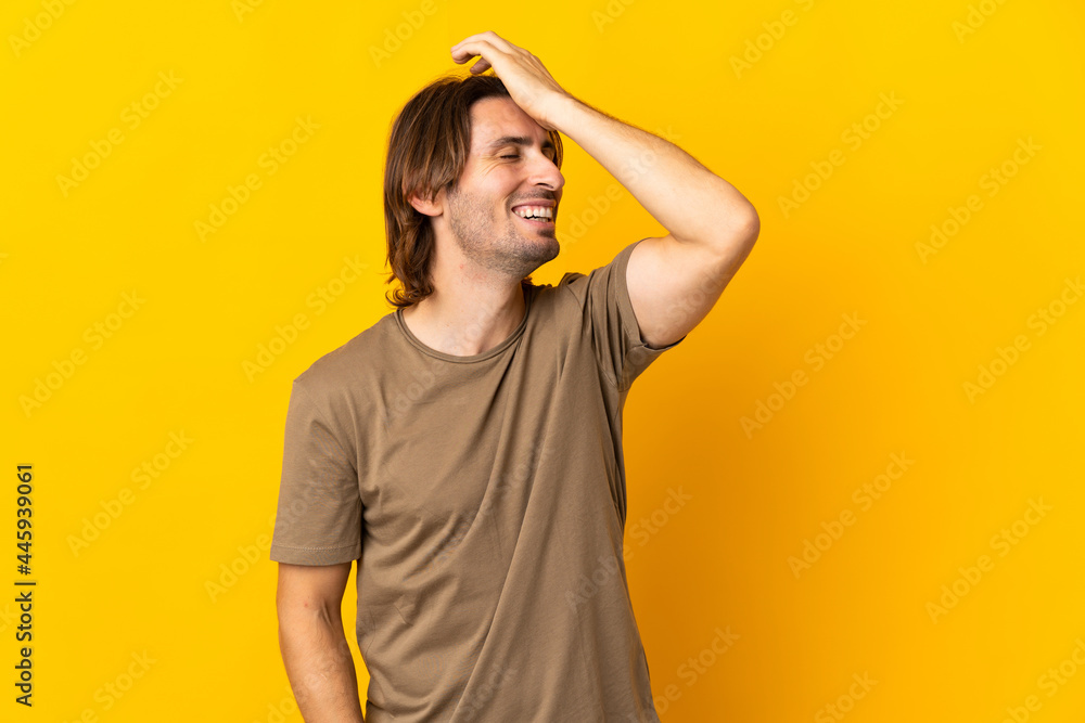 Young handsome man isolated on yellow background has realized something and intending the solution Young handsome man isolated on yellow background has realized something and intending the solution