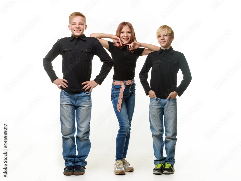 Obraz premium Happy children on a white background, two boys and a girl in casual clothes