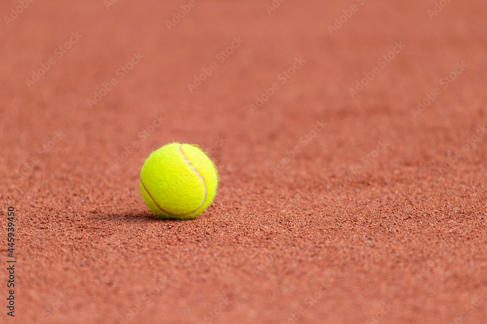 Tennis ball on a tennis clay court. Horizontal sport poster, greeting cards, headers, website