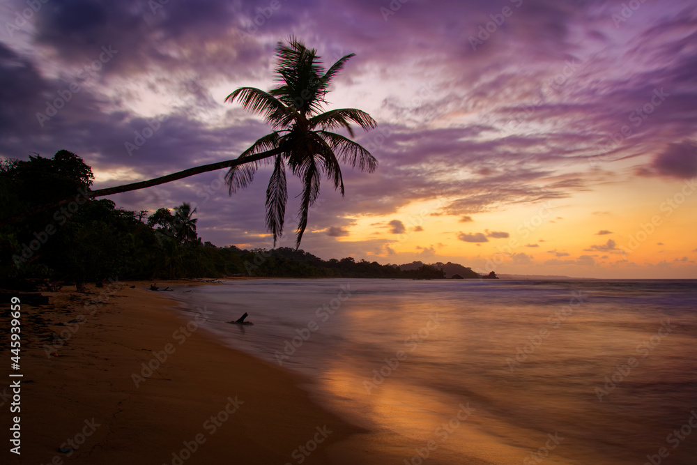 Evening scenery on the beach in Bocas del Toro, Panama. Caribbean bay with dramatic clouds on the sky, holidays in paradise