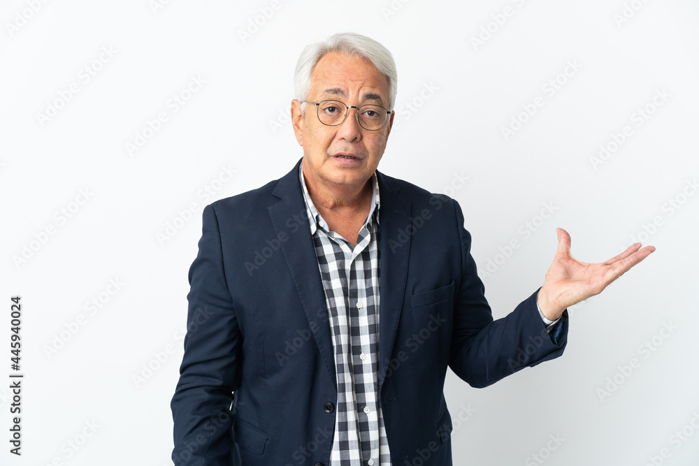 Middle age Brazilian man isolated on white background making doubts gesture Middle age Brazilian man isolated on white background making doubts gesture