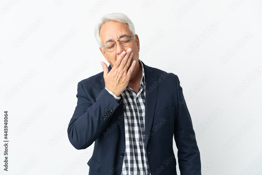 Middle age Brazilian man isolated on white background yawning and covering wide open mouth with hand Middle age Brazilian man isolated on white background yawning and covering wide open mouth with hand