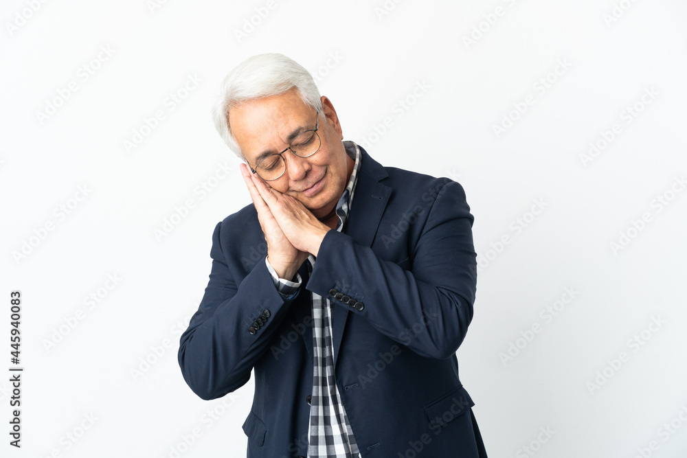 Middle age Brazilian man isolated on white background making sleep gesture in dorable expression Middle age Brazilian man isolated on white background making sleep gesture in dorable expression
