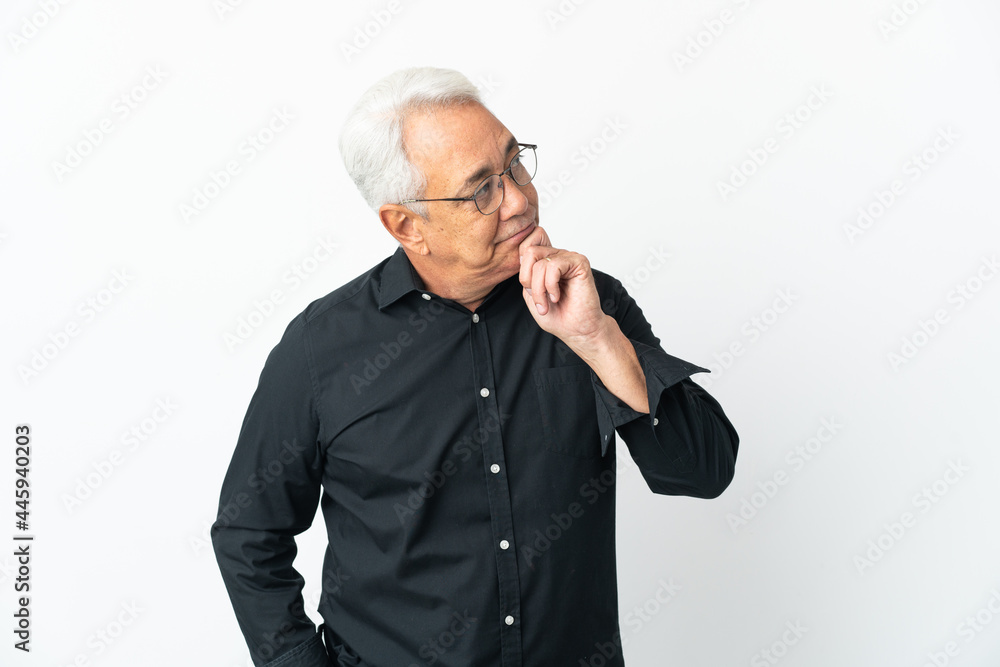 Middle age Brazilian man isolated on white background and looking up Middle age Brazilian man isolated on white background and looking up