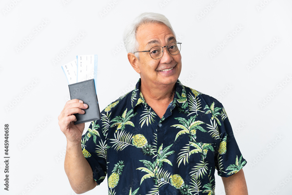 Middle age Brazilian man isolated on white background happy in vacation with passport and plane tickets Middle age Brazilian man isolated on white background happy in vacation with passport and plane tickets