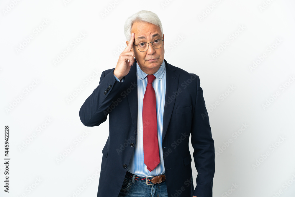 Middle age Brazilian business man isolated on white background thinking an idea Middle age Brazilian business man isolated on white background thinking an idea