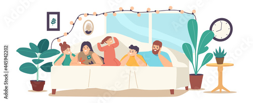 Fototapeta Naklejka Na Ścianę i Meble -  Family Characters Mother, Father and Kids Lying Under Blanket on Bed in Cozy Room Decorated with Lighting Garland