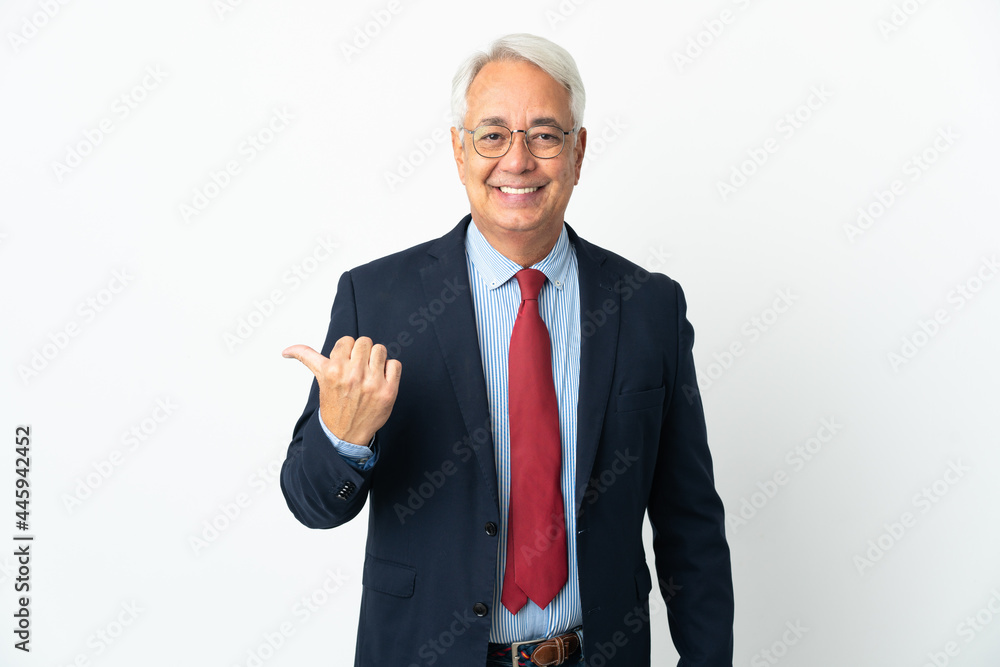 Middle age Brazilian business man isolated on white background pointing to the side to present a product Middle age Brazilian business man isolated on white background pointing to the side to present a product