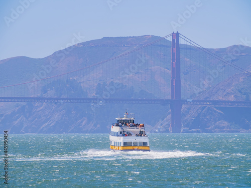 Sunny view of a cruise ship and Golden Gate Bridge