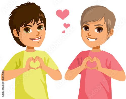 Happy male teenagers making love gesture joining hands in heart shape