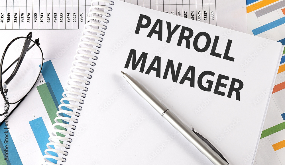 PAYROLL MANAGER text , pen and glasses on the chart PAYROLL MANAGER text , pen and glasses on the chart