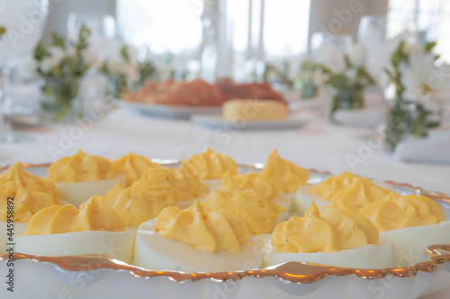 Deviled Eggs on a Table with a Large Holiday Meal