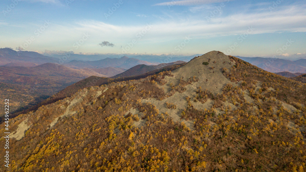 Sikhote-Alin Biosphere Reserve. View from above. The sharp peak of the bald mountain in autumn. Beautiful mountain views.