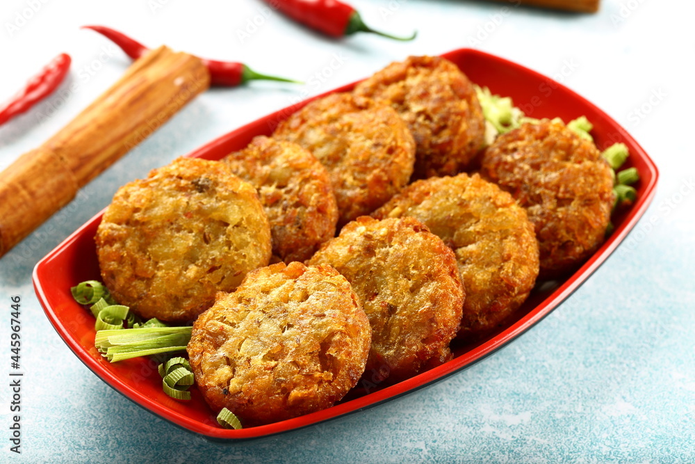 Fresh baked crispy and spicy meat cutlets. on a rustic kitchen table background.
