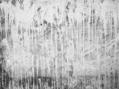 Concrete wall has white color stains flowing down. Empty old dirty grunge cement wall texture background.