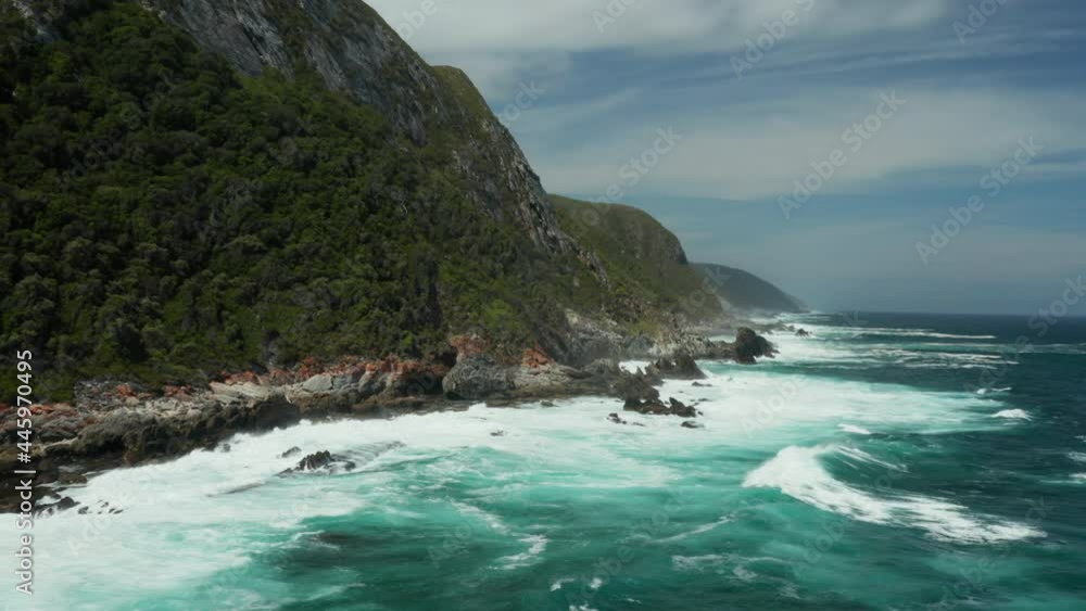 Sea Waves Breaking Against Rocky Coast Of Tsitsikamma National Park In South Africa. - aerial Sea Waves Breaking Against Rocky Coast Of Tsitsikamma National Park In South Africa. - aerial