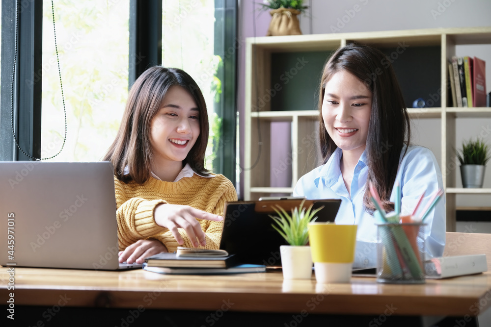 A female business consultant describes a marketing plan to set business strategies for women business owners. A female business consultant describes a marketing plan to set business strategies for women business owners.