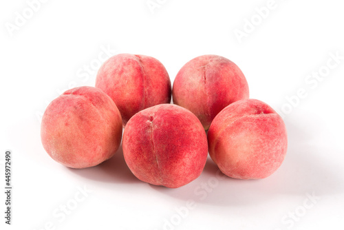 Ripe peach fruit close-up isolated on white background