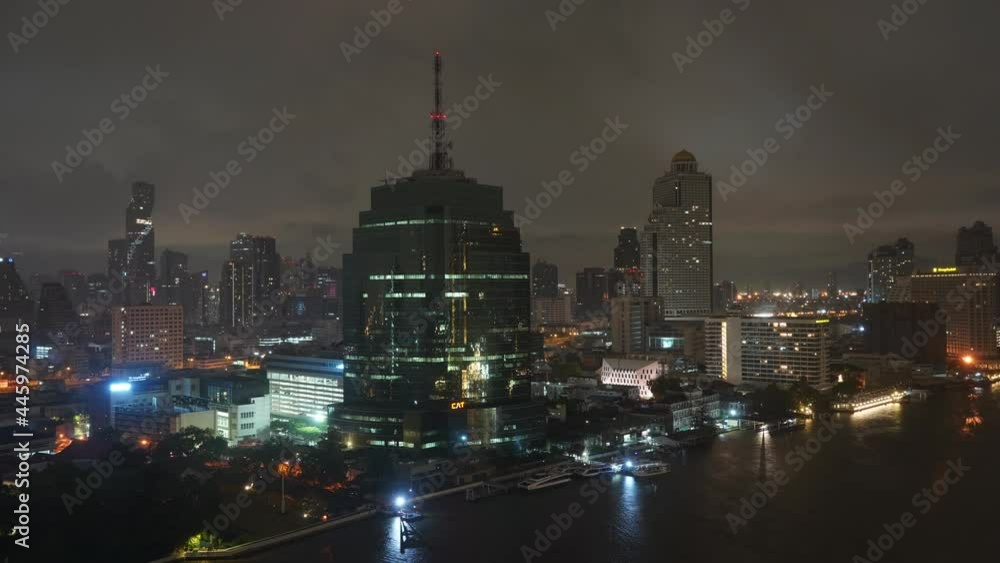 Night in Bangkok, Thailand, Timelapse. Lights on Modern Buildings, King Power Mahanakhon, Cat and State Towers in Silom Central District Night in Bangkok, Thailand, Timelapse. Lights on Modern Buildings, King Power Mahanakhon, Cat and State Towers in Silom Central District