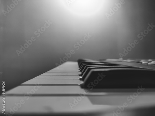 Close up Black and White stock photograph of a Piano keyboard and notes for playing music  photo