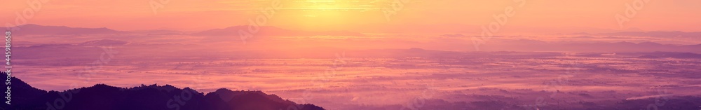 Sunrise landscape panoramic view with the sun and misty at Chiang Rai province northern of Thailand