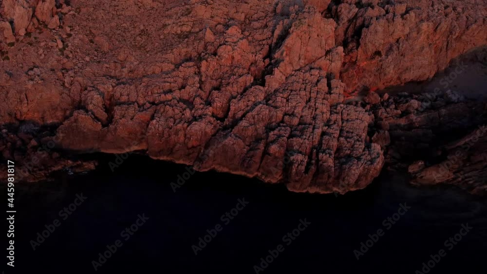 beautiful drone reveal of a watchtower under sunset light in mediterranean sea 4K. beautiful drone reveal of a watchtower under sunset light in mediterranean sea 4K.