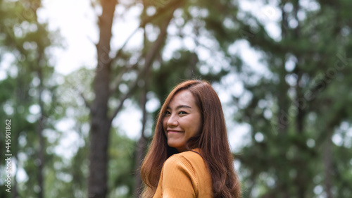 Portrait image of a beautiful young asian woman in the park