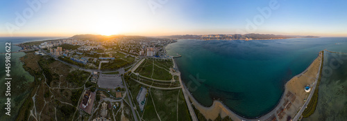 Novorossiysk, Russia. The central part of the city. Sudzhukskaya Spit. Sunset. Panoarma 360. Aerial view photo