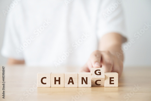Hand flip wooden cube with word change to chance, Personal development and career growth or change yourself concept photo