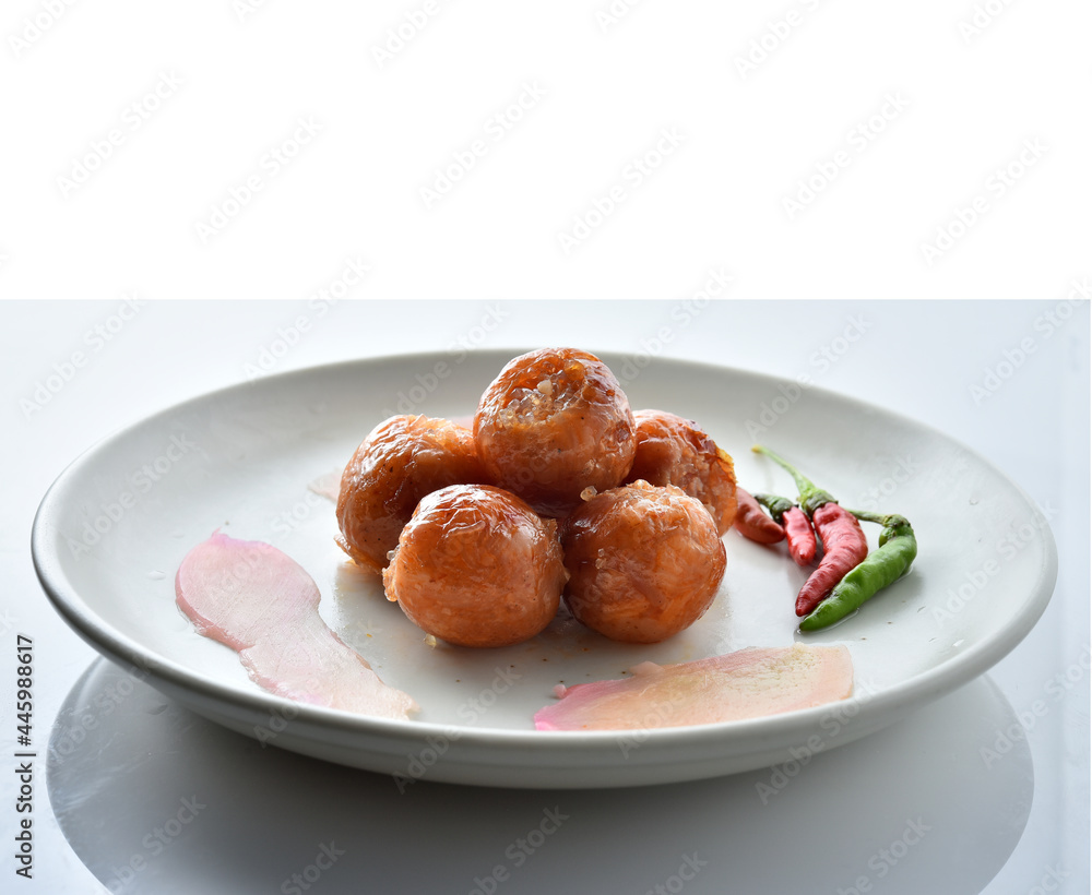 Northeastern Sausage in a white plate on a white background. Northeastern Sausage in a white plate on a white background.