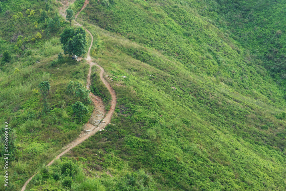 A long and winding rural path crosses the hill A long and winding rural path crosses the hill