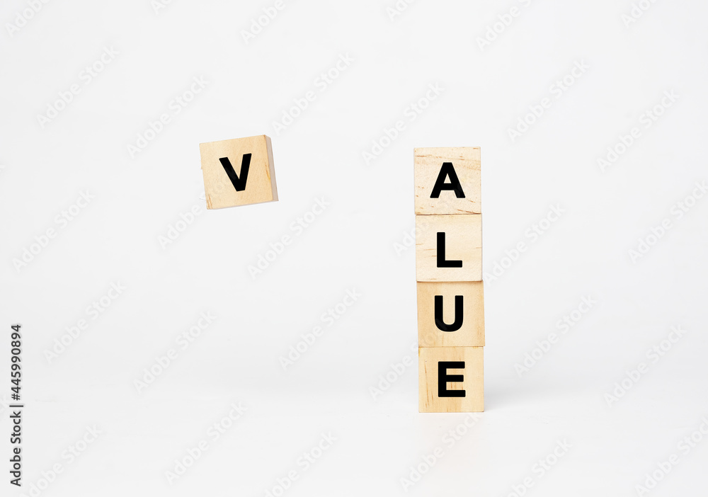 A picture of levitation V word wooden block from ALUE word. Creating value concept A picture of levitation V word wooden block from ALUE word. Creating value concept