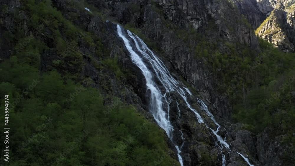 Drone shot of waterfall in Norway, descent and tilt upwards. Drone shot of waterfall in Norway, descent and tilt upwards.