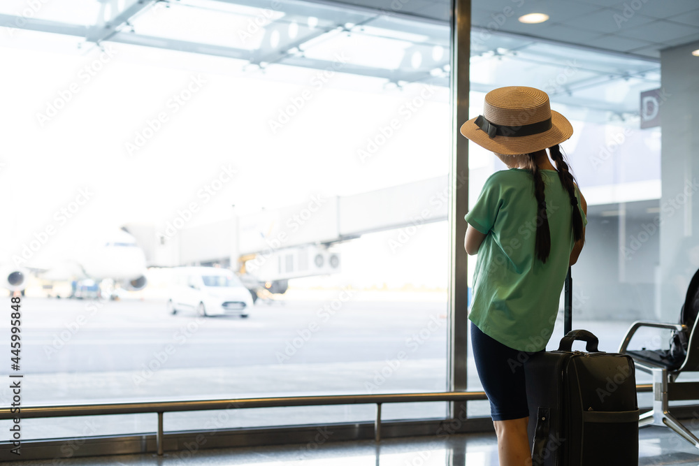 little girl with suitcase travel in the airport, kids travel