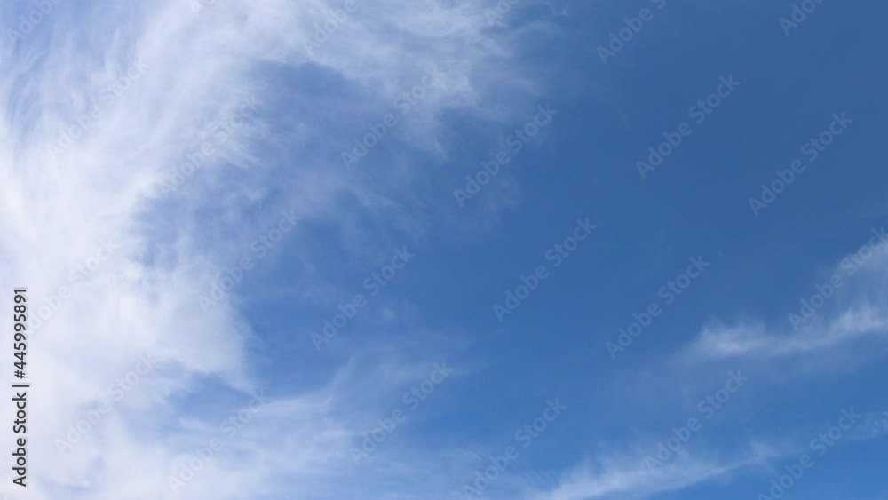 Thin cirrus clouds in the blue sky, time-lapse. Cloudy sky video.
Thin cirrus clouds in the blue sky, time-lapse. Cloudy sky video.