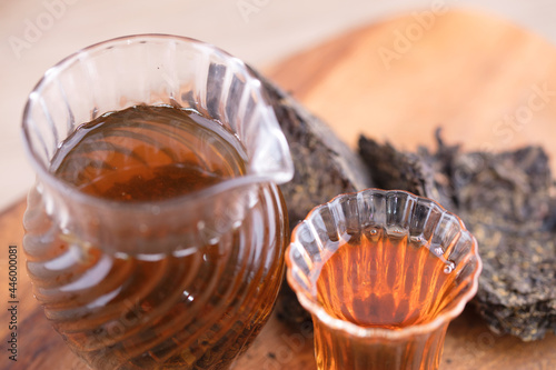 Closeup black tea tea soup and black tea cubes photo