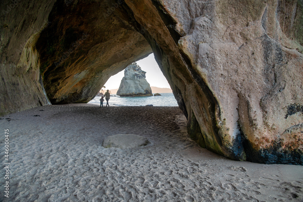 Woman with her child enjoying Cathedral Cove, New Zealand