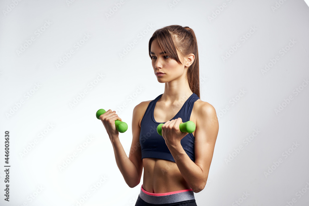 woman holding dumbbells strength exercises fitness muscles woman holding dumbbells strength exercises fitness muscles